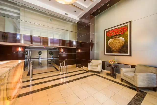a view of living room with furniture and rug