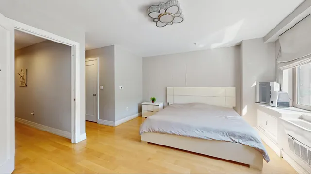 a bathroom with a shower and a sink