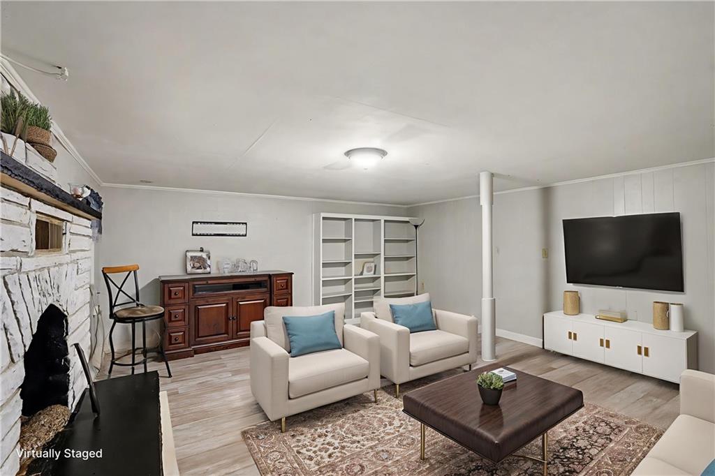 254 County Line Road Fayetteville, GA 30215 - Photo 13 of 51 a living room with furniture and a flat screen tv