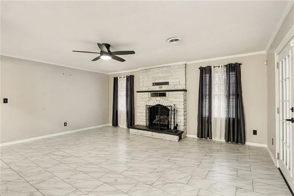 254 County Line Road Fayetteville, GA 30215 - Photo 16 of 51 a view of a livingroom with a fireplace and a chandelier fan
