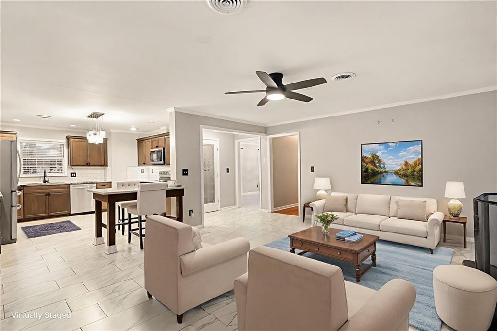 254 County Line Road Fayetteville, GA 30215 - Photo 17 of 51 a living room with furniture and kitchen view
