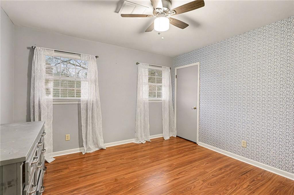 254 County Line Road Fayetteville, GA 30215 - Photo 25 of 51 a view of a room with wooden floor and ceiling fan