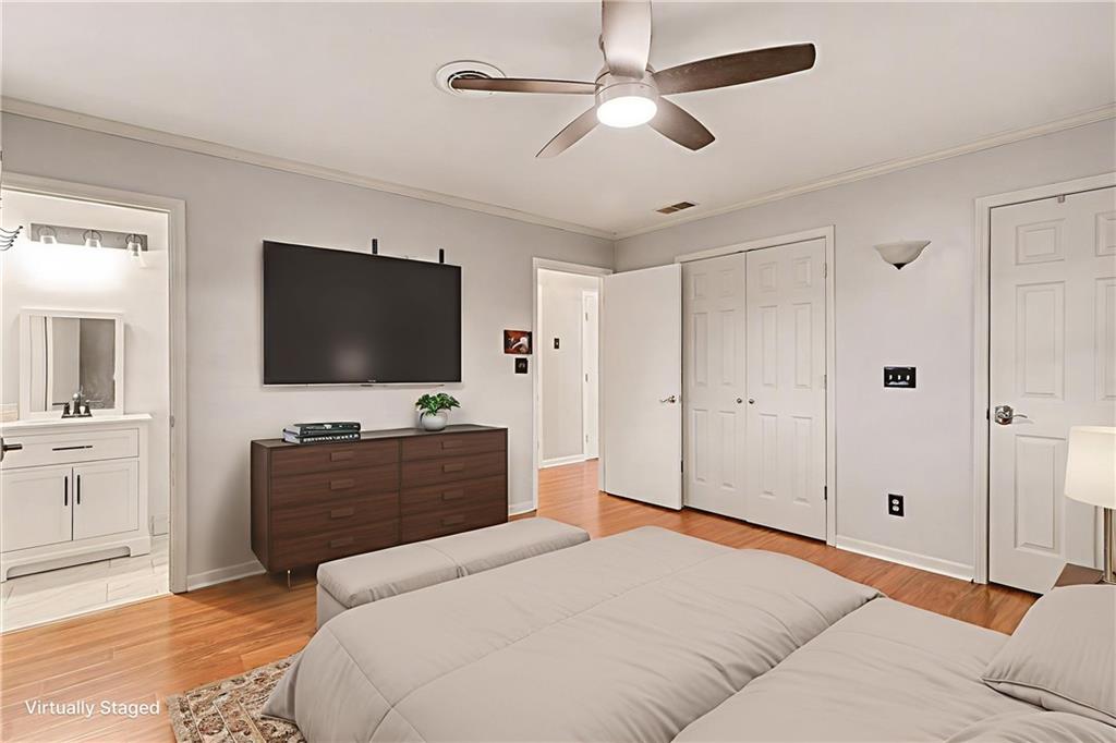 254 County Line Road Fayetteville, GA 30215 - Photo 30 of 51 a bedroom with a bed and a flat screen tv