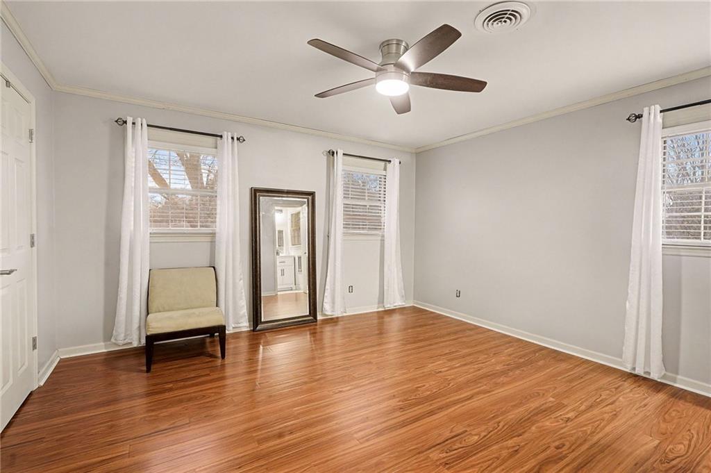 254 County Line Road Fayetteville, GA 30215 - Photo 32 of 51 an empty room with wooden floor and windows