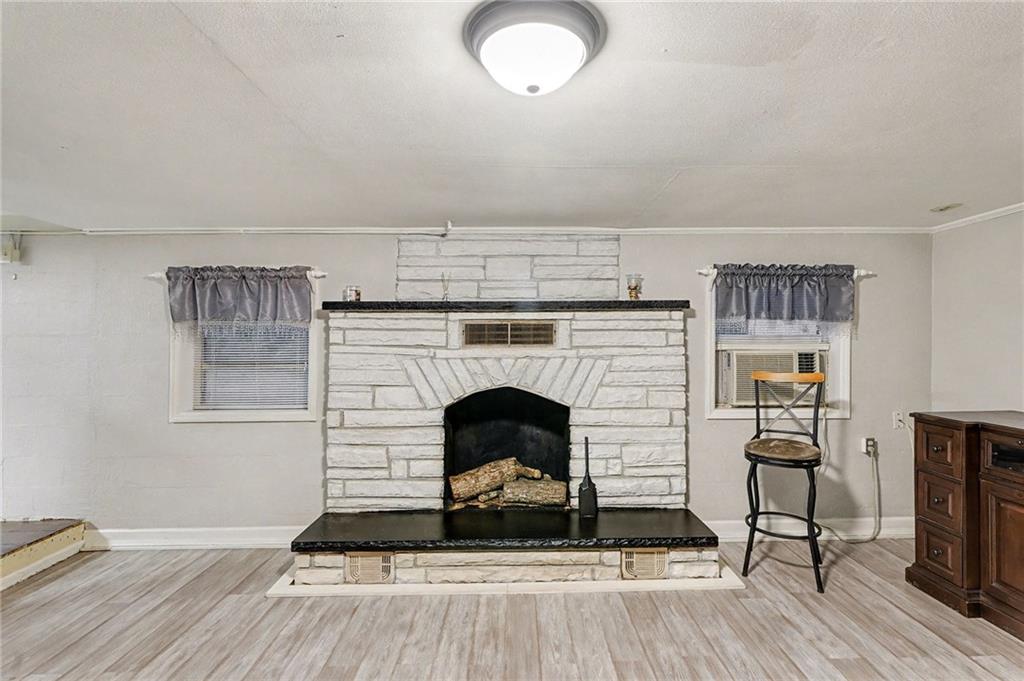 254 County Line Road Fayetteville, GA 30215 - Photo 10 of 51 a living room with furniture and a fireplace