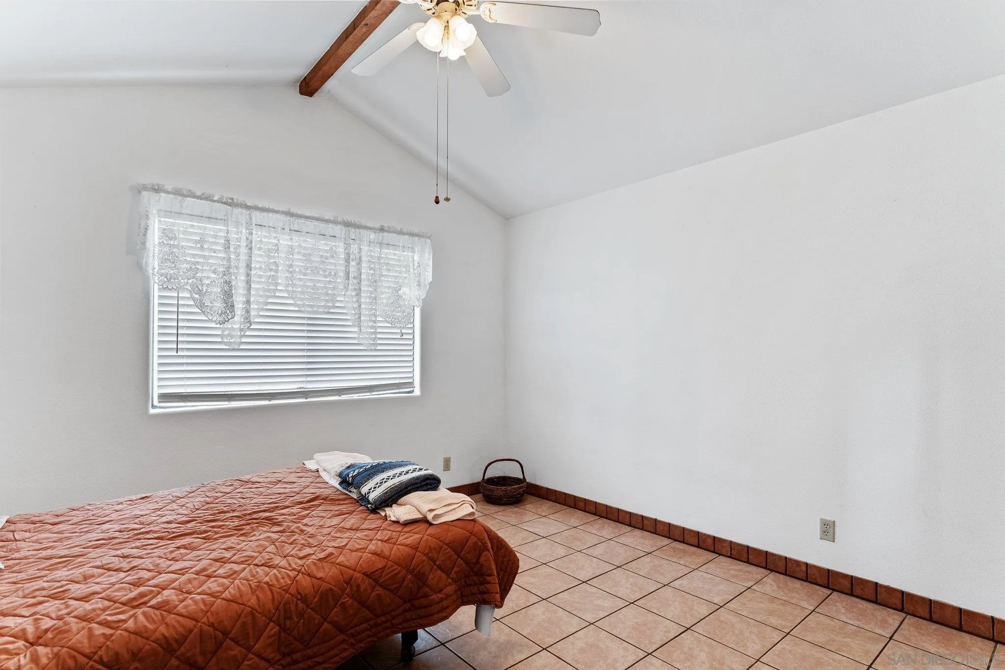 9202 Moon Ridge Road Fallbrook, CA 92028 - Photo 15 of 44 a bedroom with a bed and a window