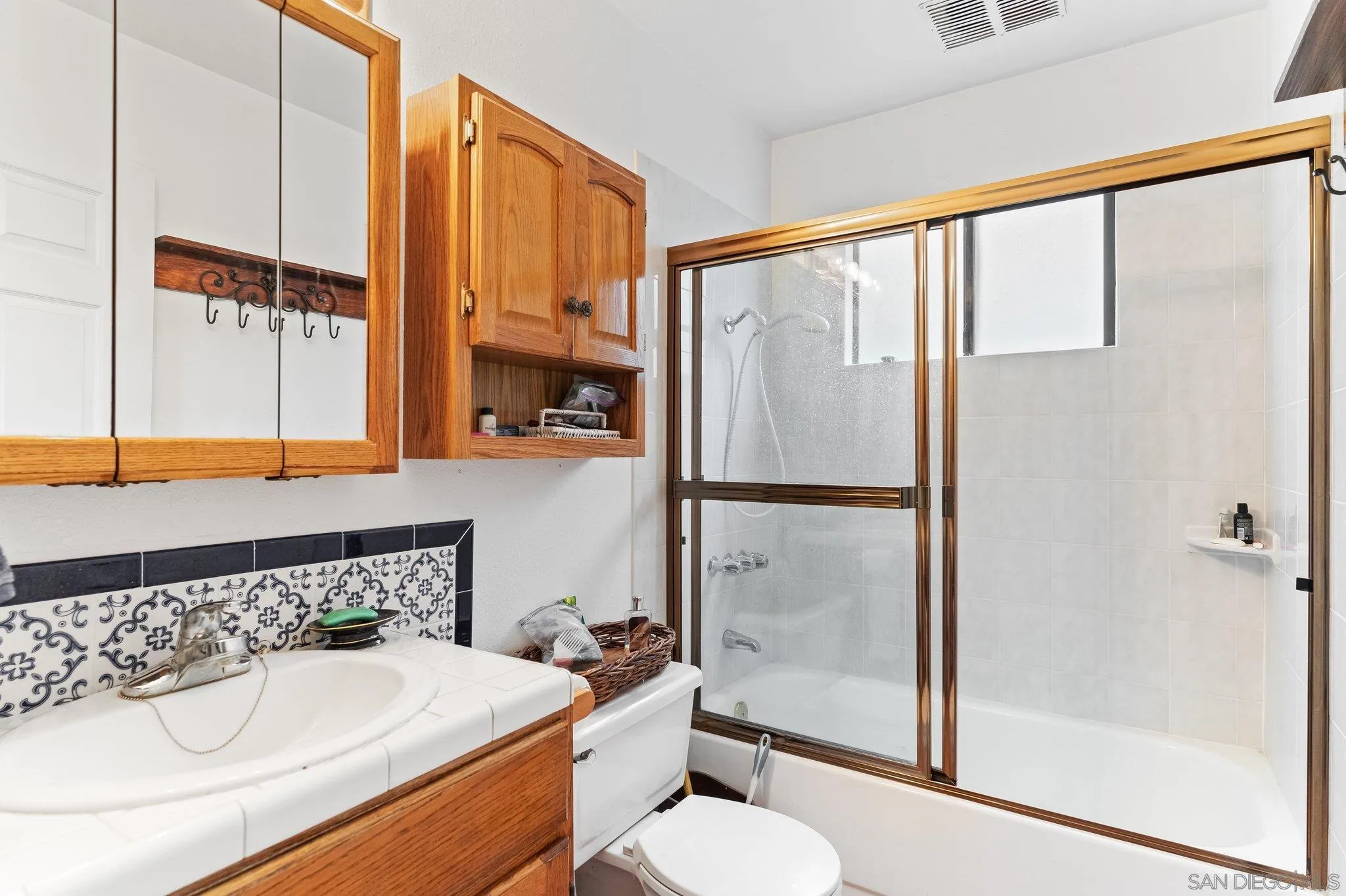 9202 Moon Ridge Road Fallbrook, CA 92028 - Photo 16 of 44 a bathroom with a sink and a mirror