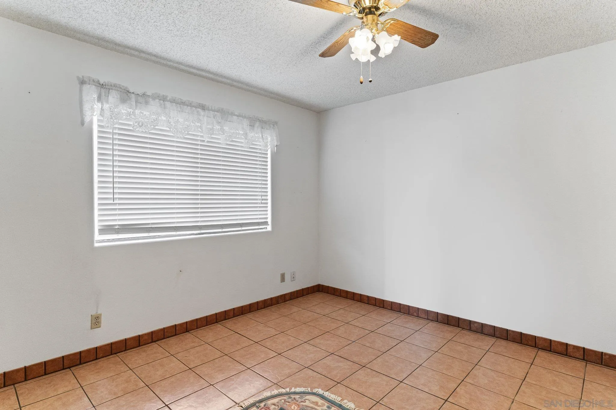 9202 Moon Ridge Road Fallbrook, CA 92028 - Photo 17 of 44 a view of an empty room with a window