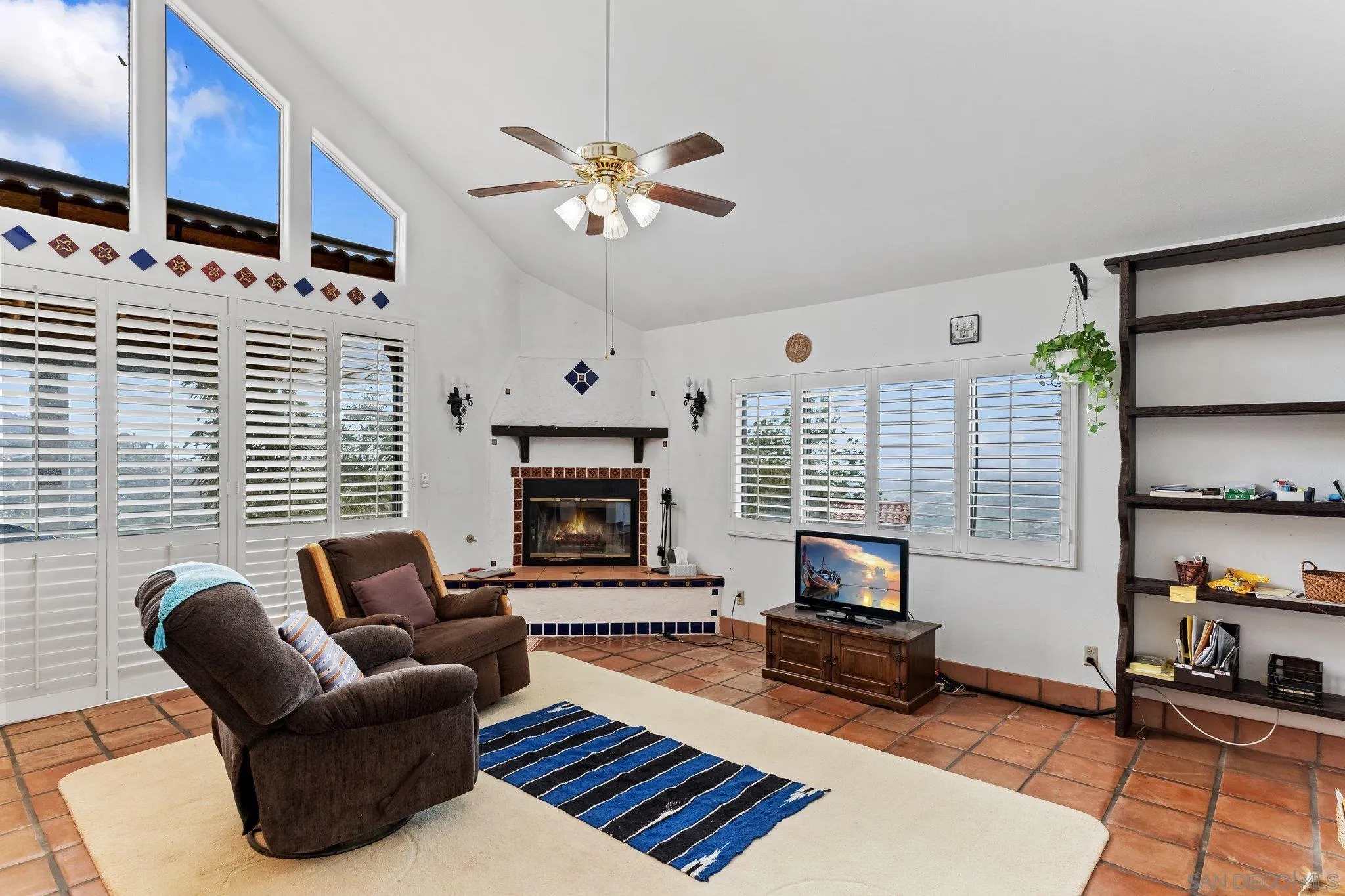 9202 Moon Ridge Road Fallbrook, CA 92028 - Photo 18 of 44 a living room with furniture fireplace and flat screen tv