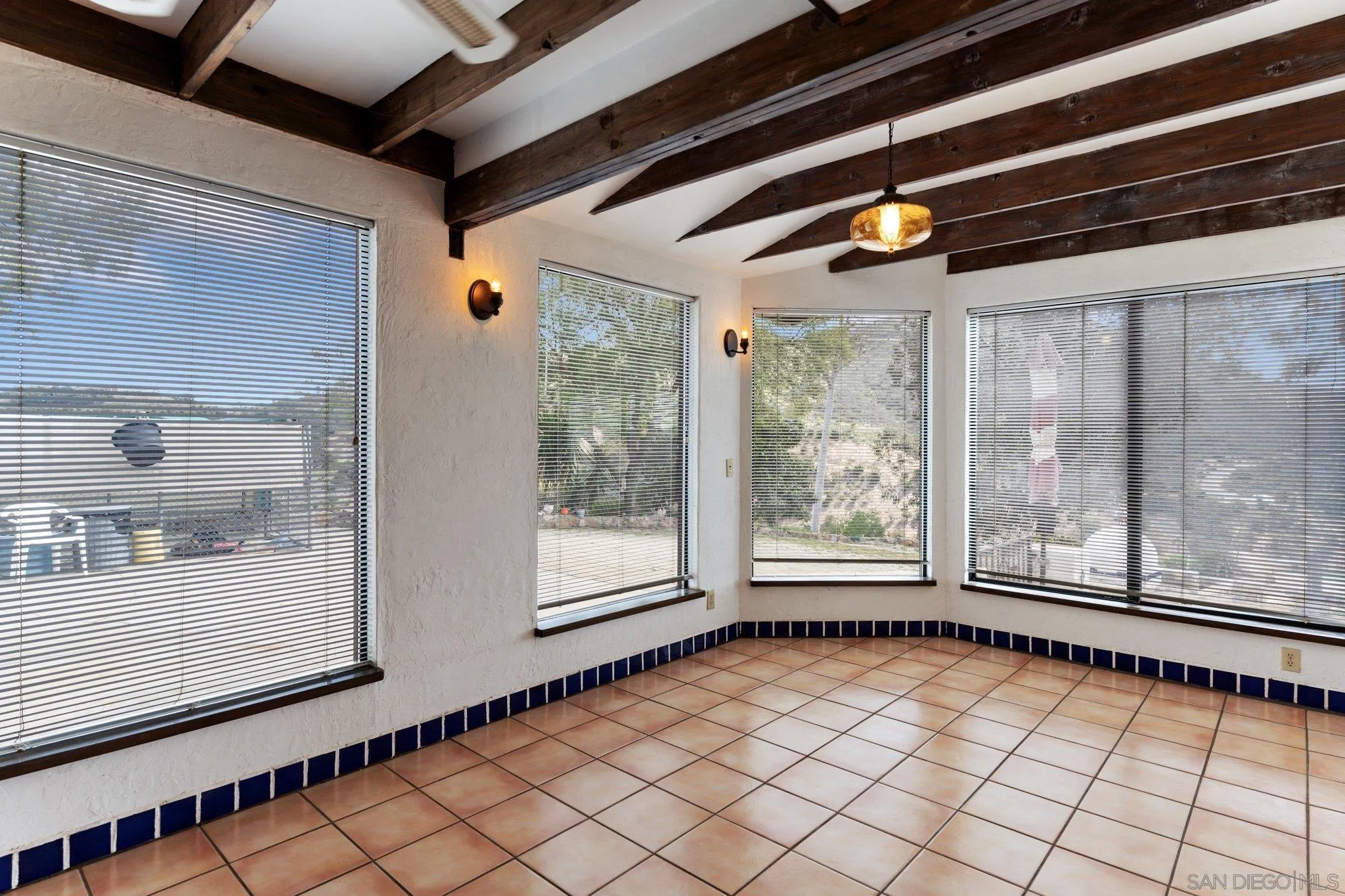 9202 Moon Ridge Road Fallbrook, CA 92028 - Photo 20 of 44 a view of empty room with wooden floor and fan