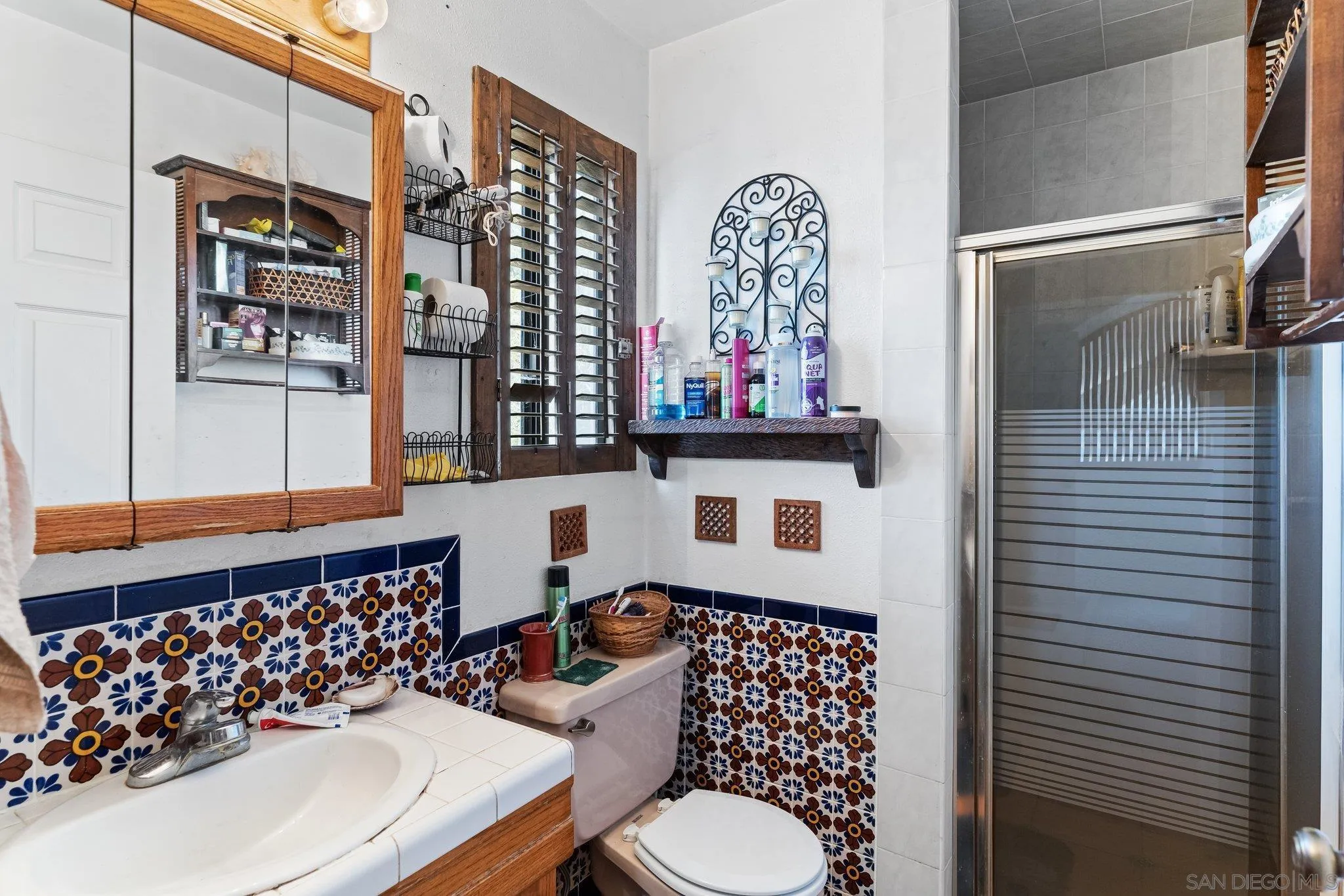 9202 Moon Ridge Road Fallbrook, CA 92028 - Photo 23 of 44 a bathroom with a sink toilet and shower