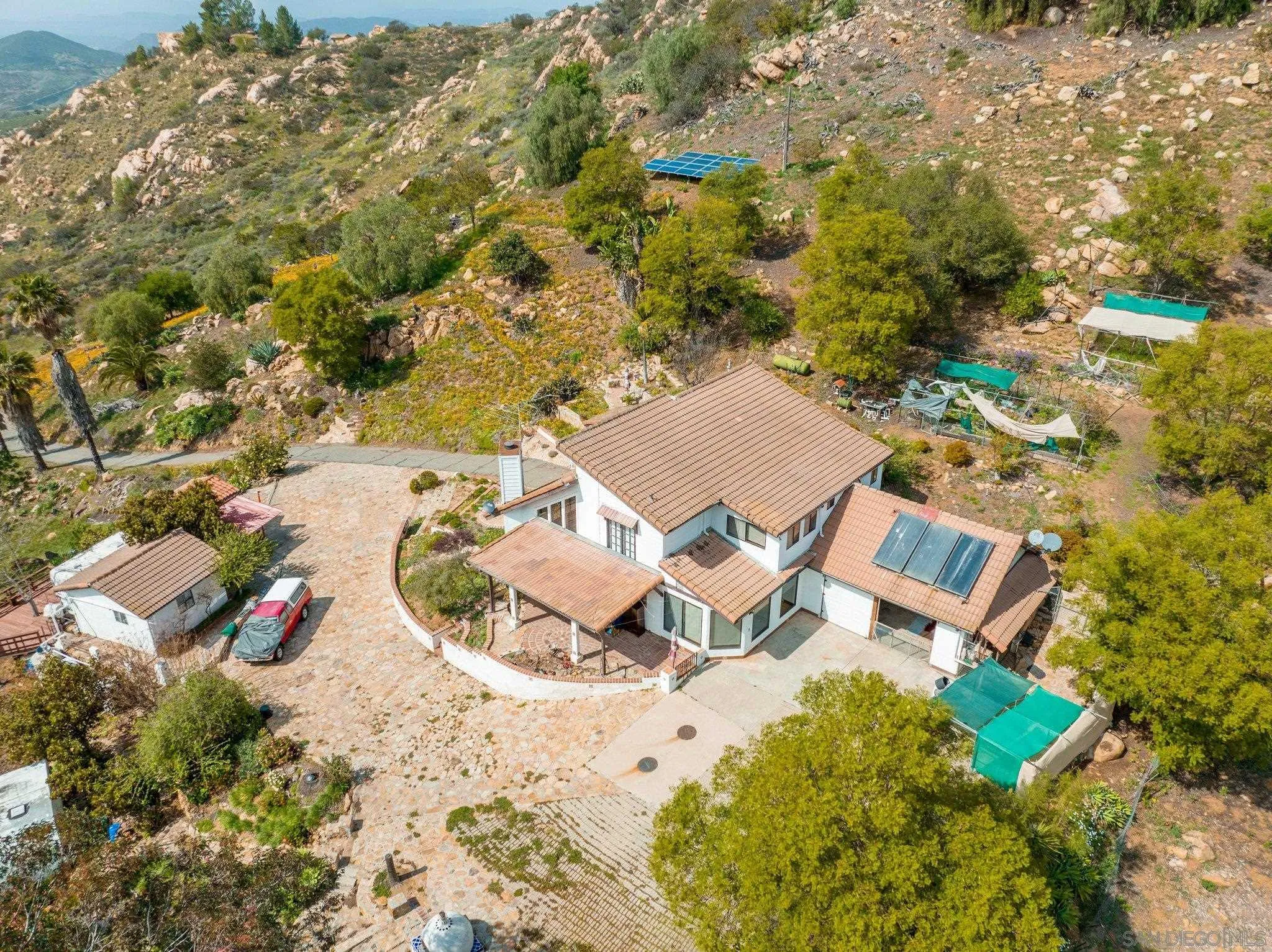 9202 Moon Ridge Road Fallbrook, CA 92028 - Photo 3 of 44 an aerial view of a house with a yard