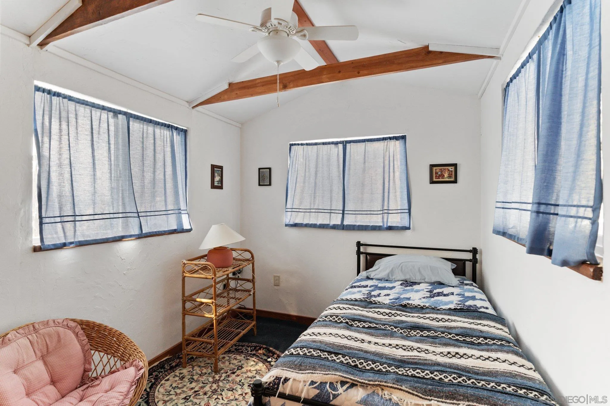 9202 Moon Ridge Road Fallbrook, CA 92028 - Photo 36 of 44 a bedroom with a bed and a window