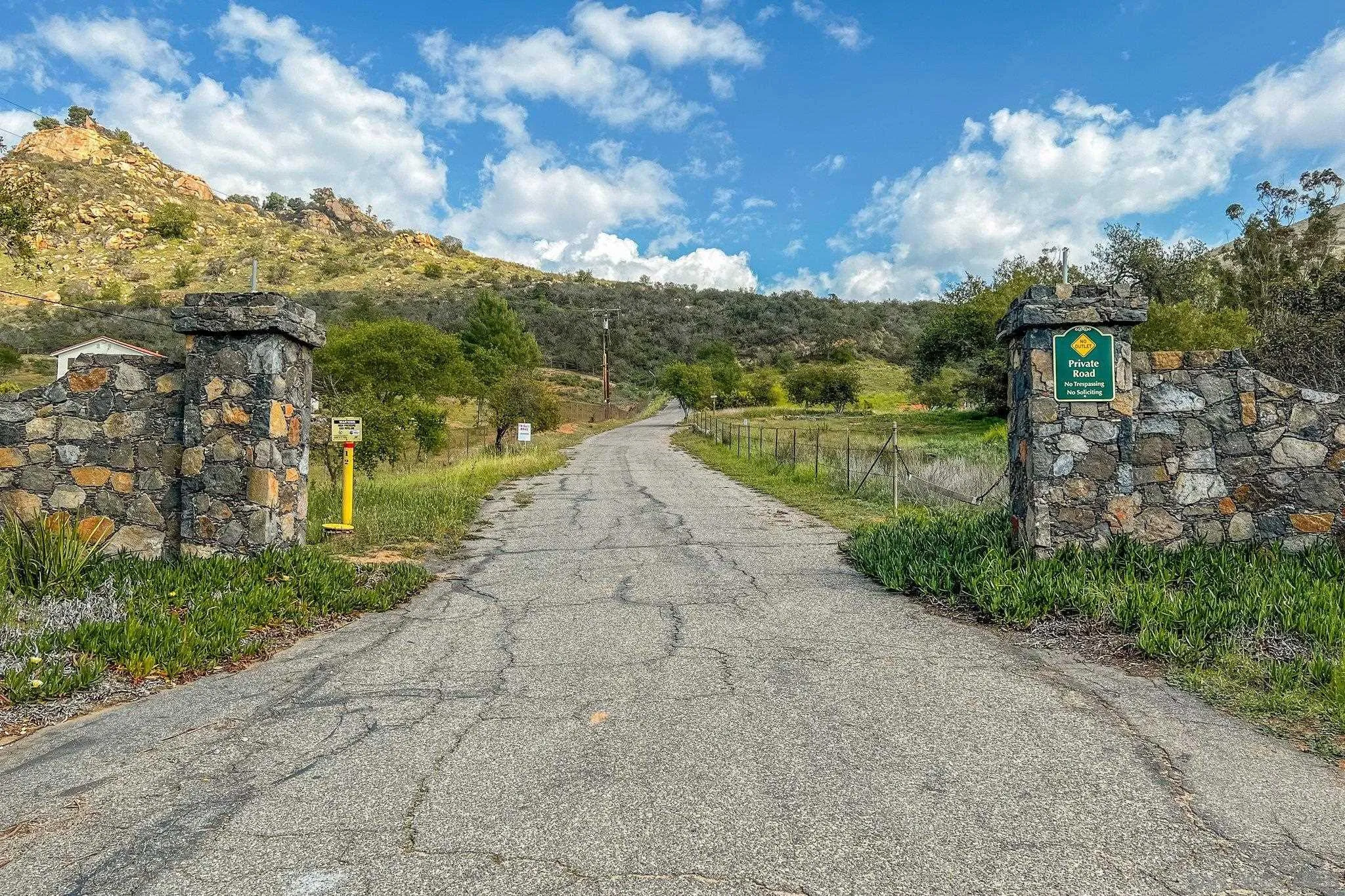 9202 Moon Ridge Road Fallbrook, CA 92028 - Photo 44 of 44 a view of a pathway with a wrought fence