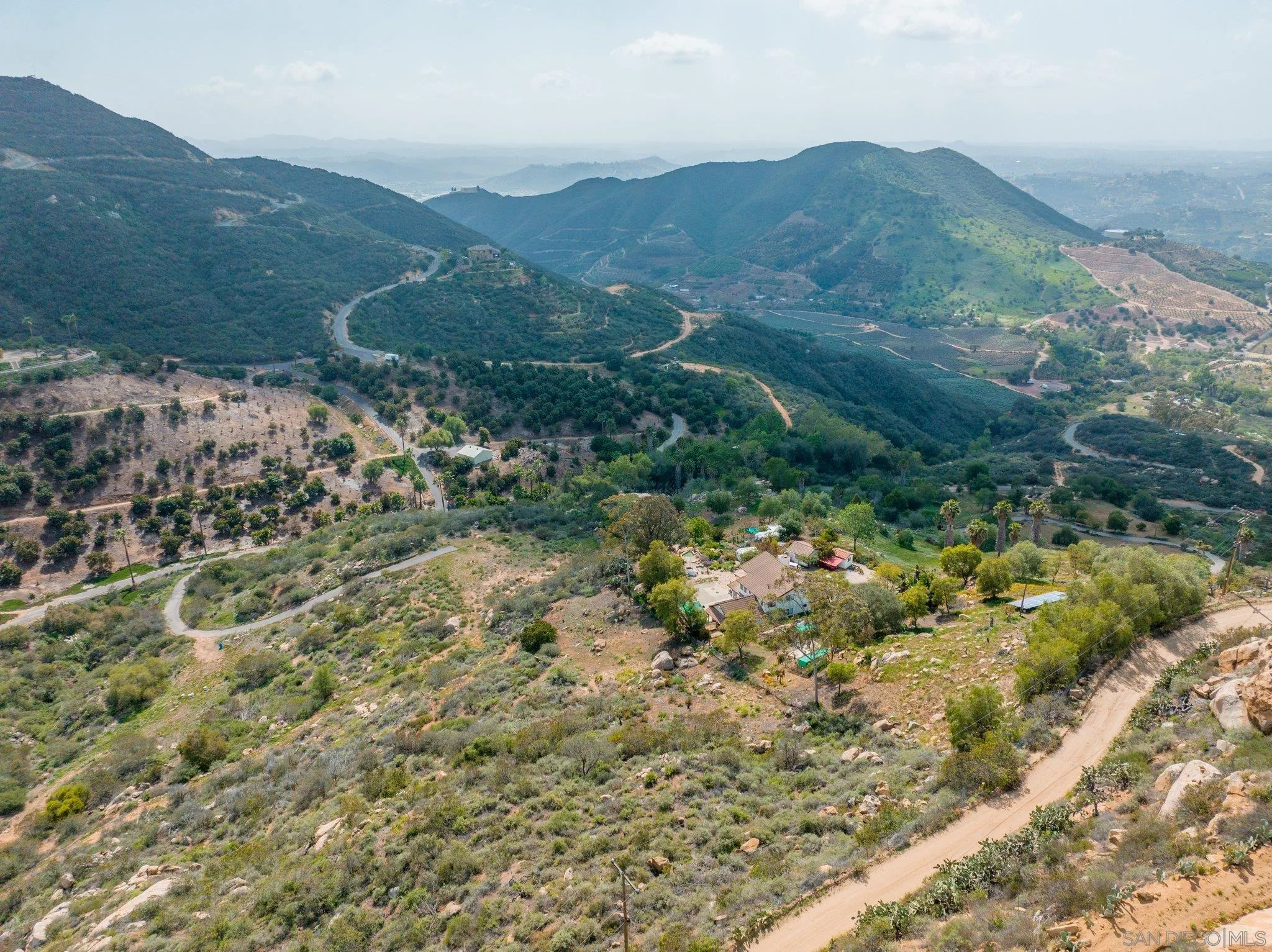 9202 Moon Ridge Road Fallbrook, CA 92028 - Photo 6 of 44 a view of a mountain in the distance in a field