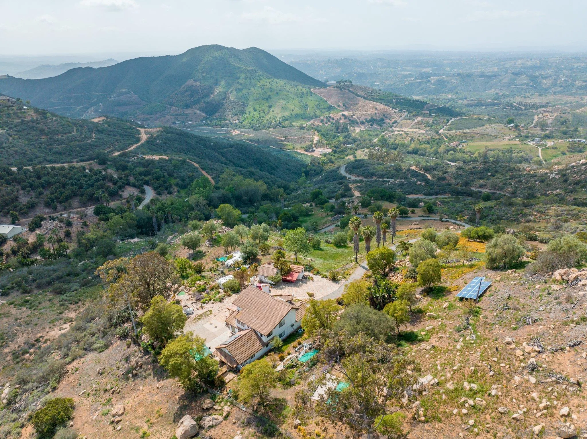 9202 Moon Ridge Road Fallbrook, CA 92028 - Photo 7 of 44 a view of a lake with mountains in the background