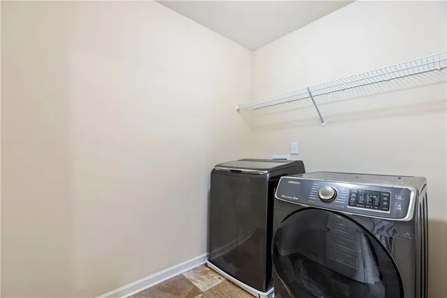a utility room with dryer and washer