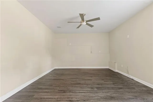 a view of a kitchen with wooden floor