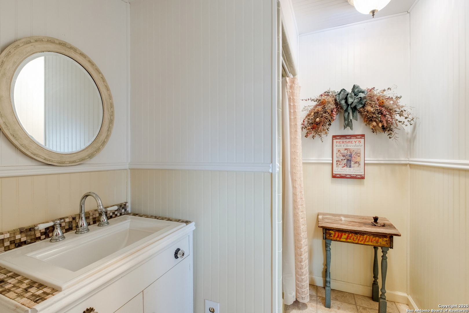 461 Highway 173 Devine, TX 78016 - Photo 18 of 27 a bathroom with a sink and a mirror