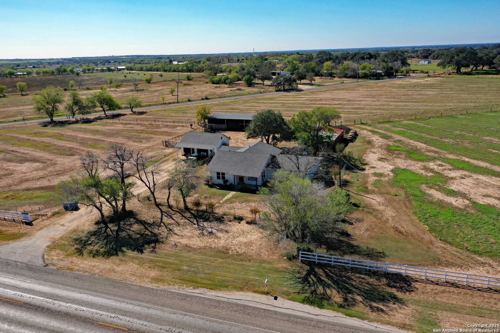 461 Highway 173 Devine, TX 78016 - Photo 2 of 27 an aerial view of a house with a lake view