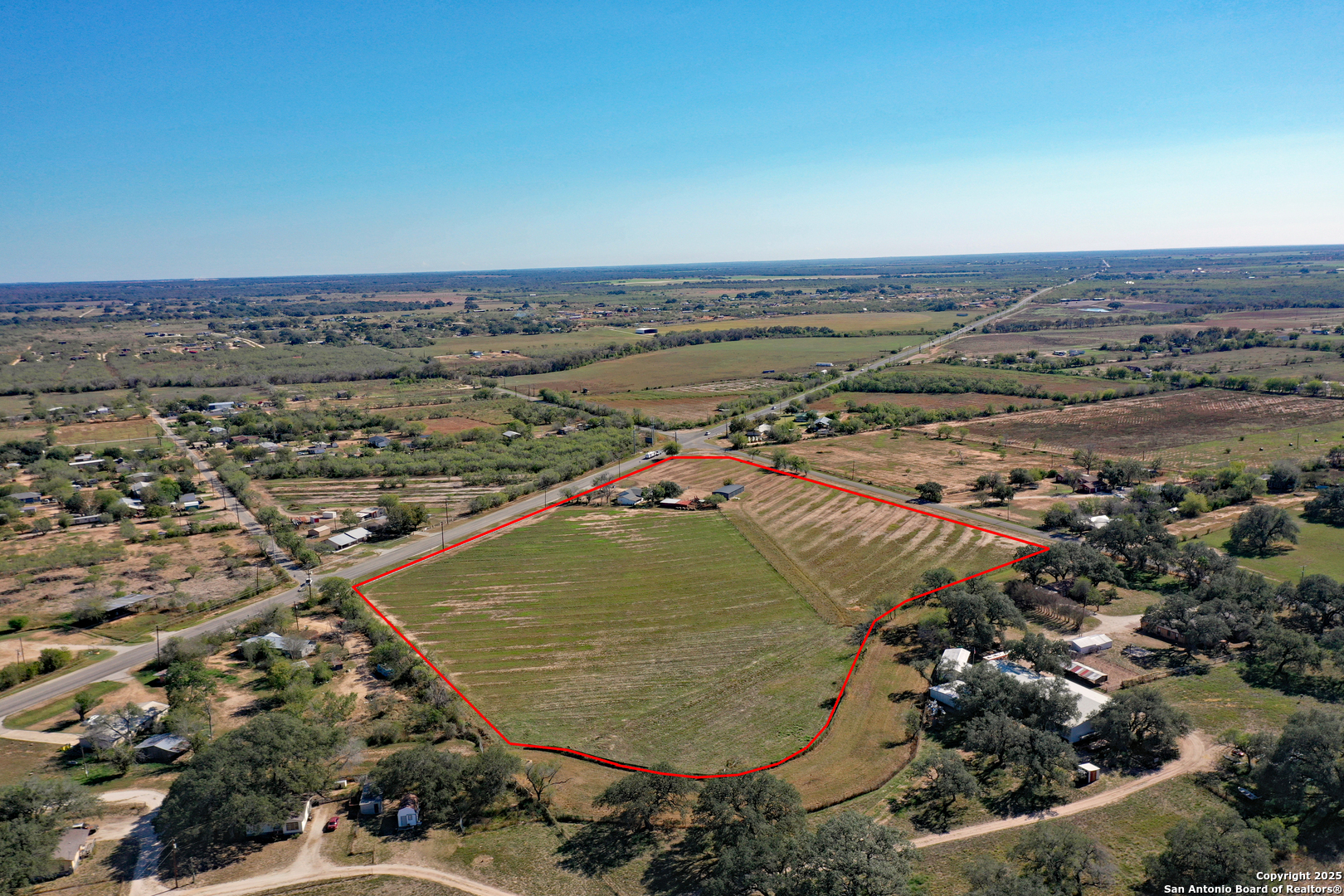 461 Highway 173 Devine, TX 78016 - Photo 24 of 27 an aerial view of a residential houses with outdoor space