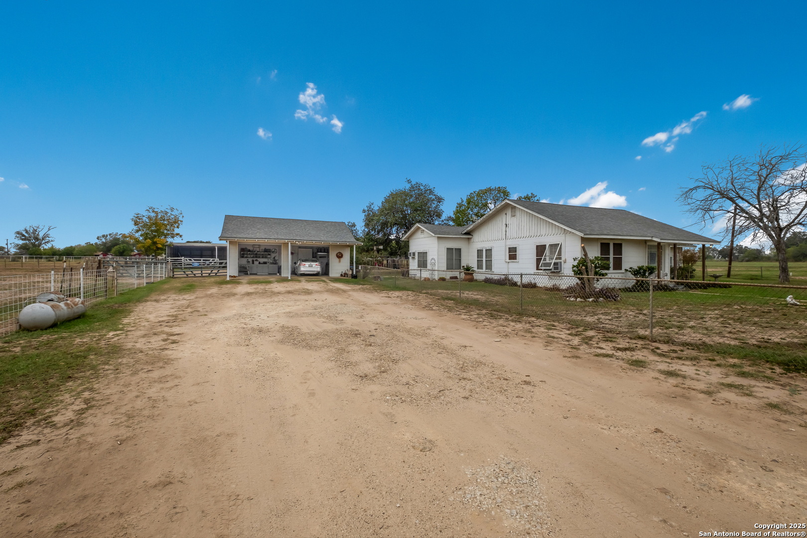 461 Highway 173 Devine, TX 78016 - Photo 3 of 27 a view of house with outdoor space and sitting area