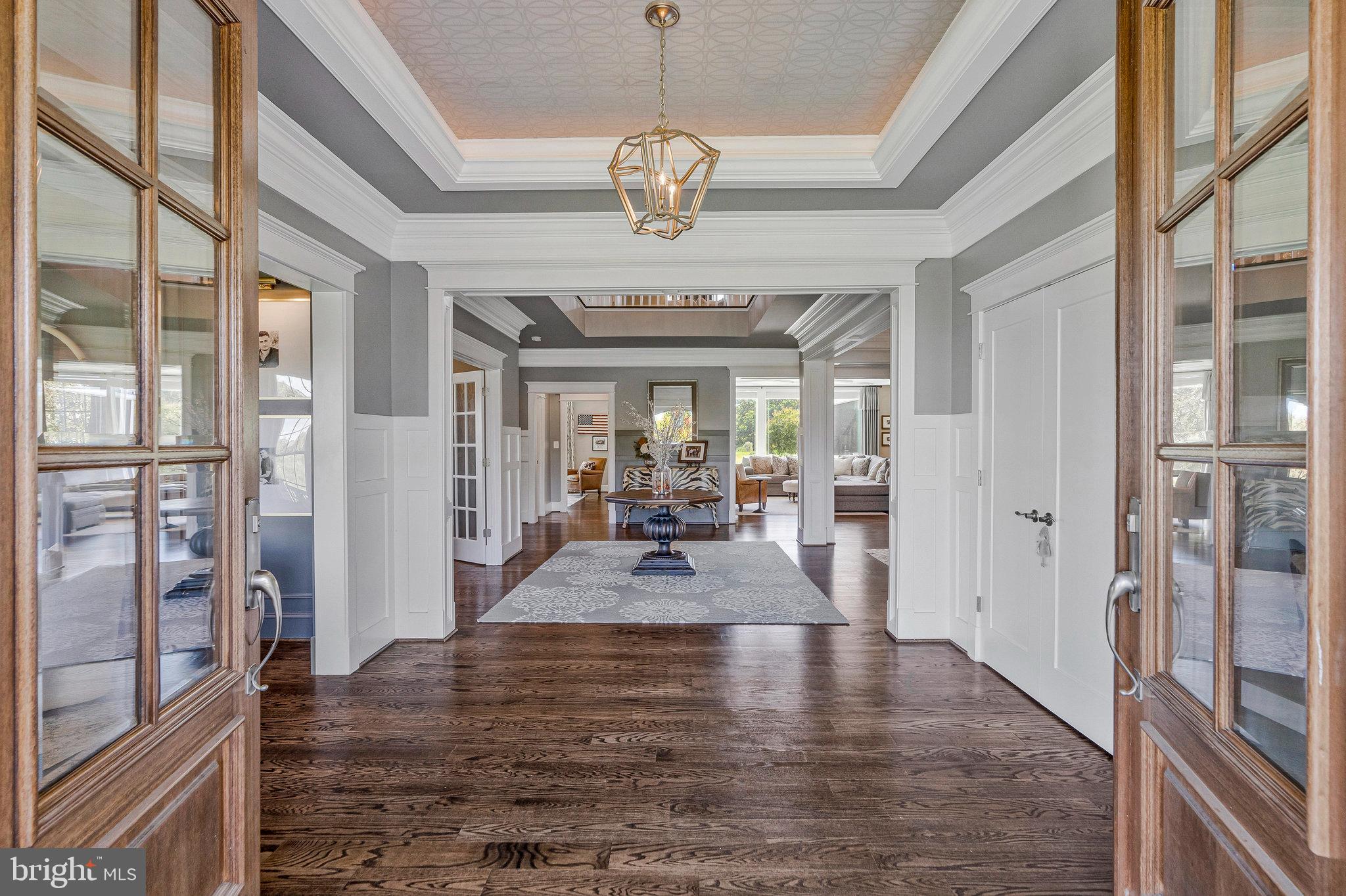 41865 Scotchbridge Place Ashburn, VA 20148 - Photo 18 of 93 a view of a dining room with furniture large window and wooden floor
