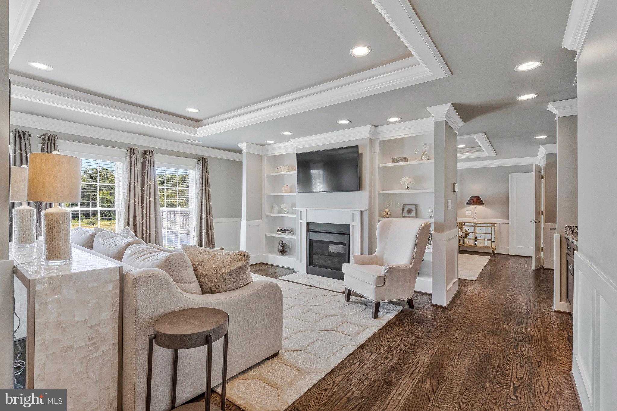 41865 Scotchbridge Place Ashburn, VA 20148 - Photo 45 of 93 a living room with fireplace furniture and a wooden floor