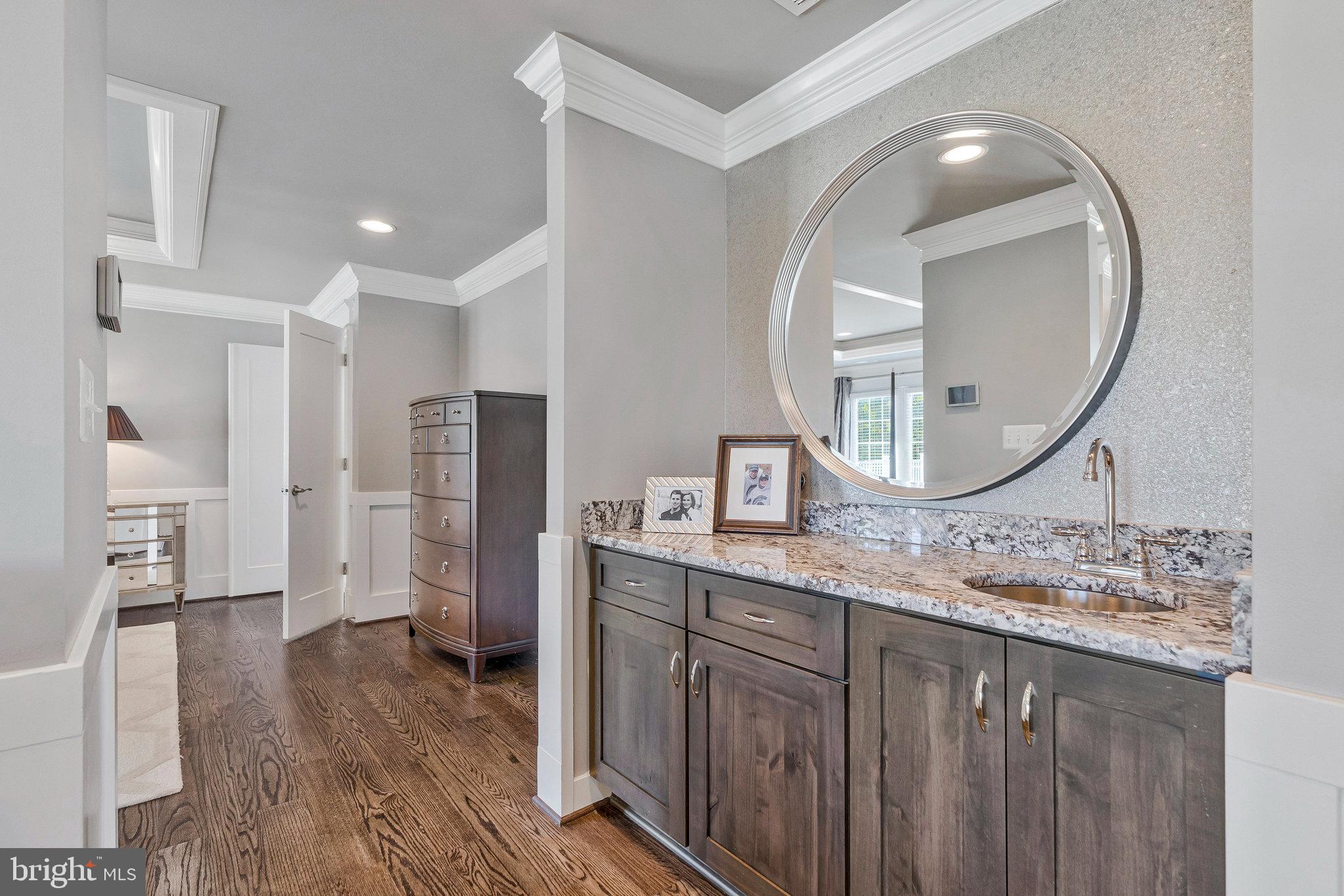 41865 Scotchbridge Place Ashburn, VA 20148 - Photo 46 of 93 a spacious bathroom with a granite countertop sink a mirror and a shower