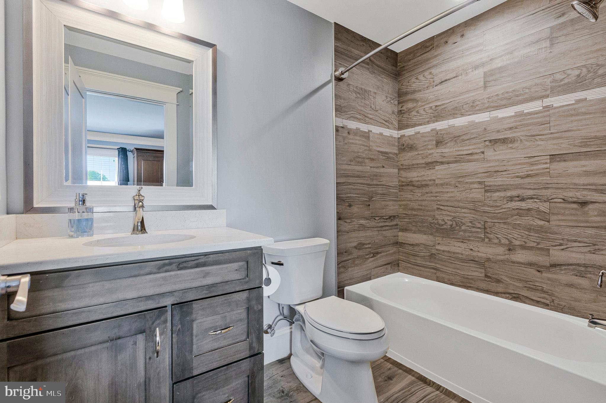 41865 Scotchbridge Place Ashburn, VA 20148 - Photo 54 of 93 a bathroom with a sink a toilet and shower