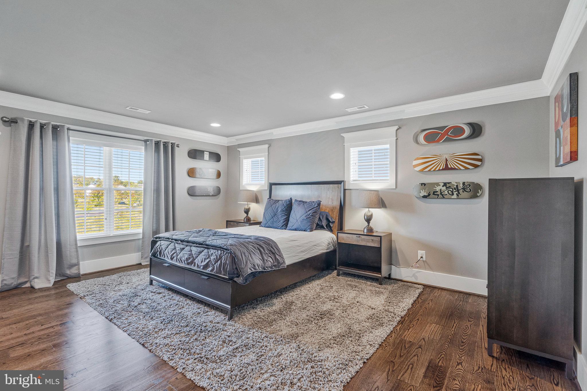 41865 Scotchbridge Place Ashburn, VA 20148 - Photo 55 of 93 a bedroom with a large bed and a window