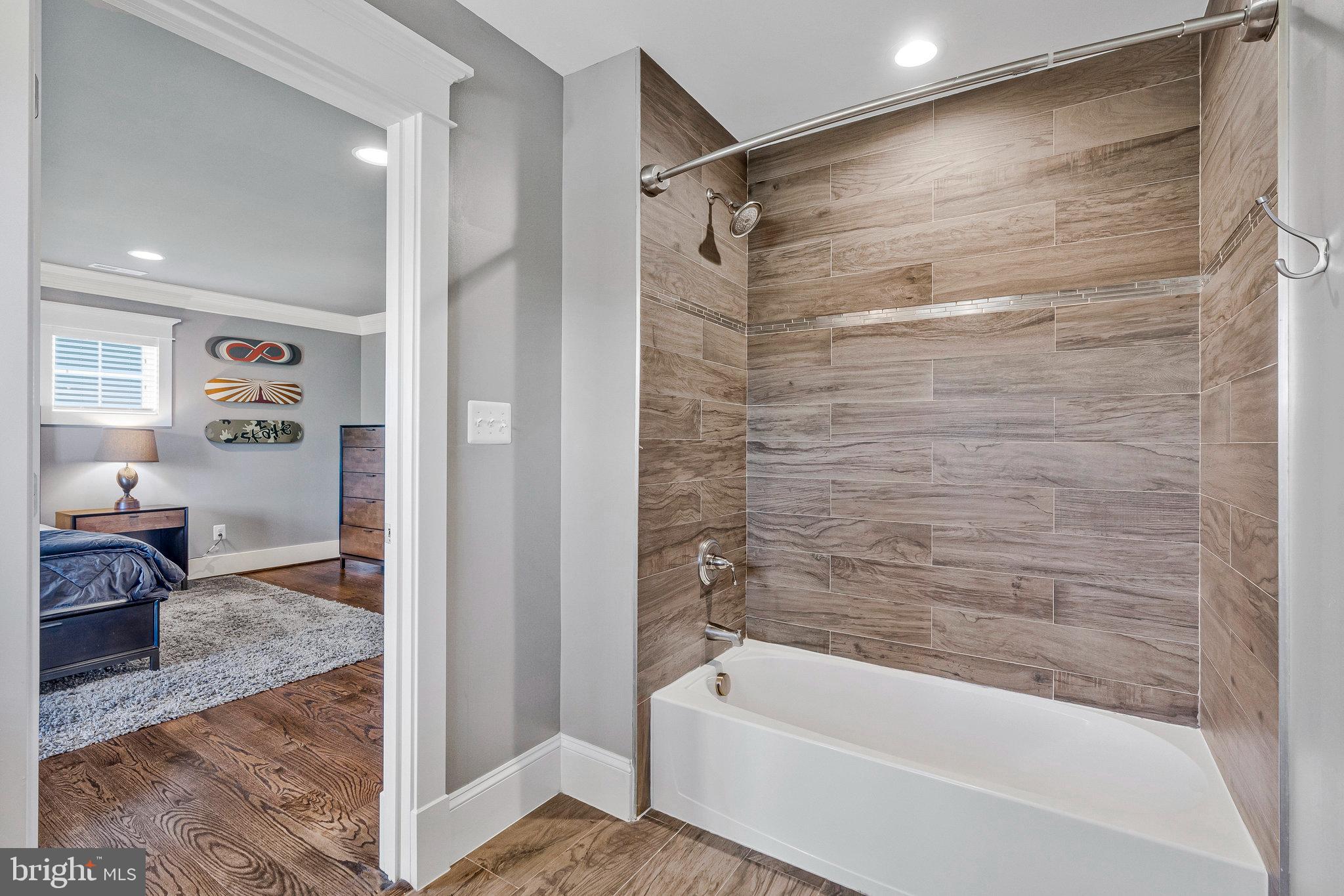 41865 Scotchbridge Place Ashburn, VA 20148 - Photo 57 of 93 a bathroom with a bathtub and a shower