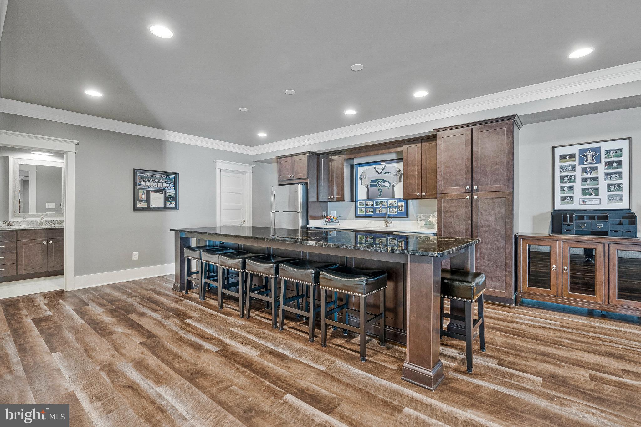 41865 Scotchbridge Place Ashburn, VA 20148 - Photo 64 of 93 a dining hall with stainless steel appliances granite countertop a stove oven a granite counter tops and chairs