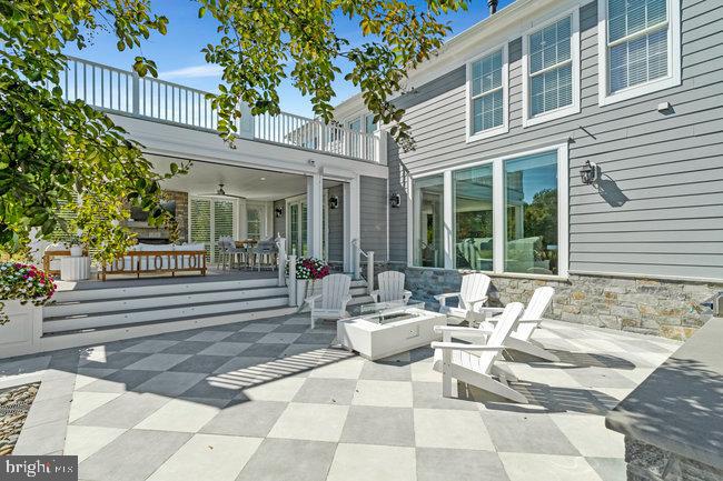 41865 Scotchbridge Place Ashburn, VA 20148 - Photo 76 of 93 a view of a patio with table and chairs and potted plants
