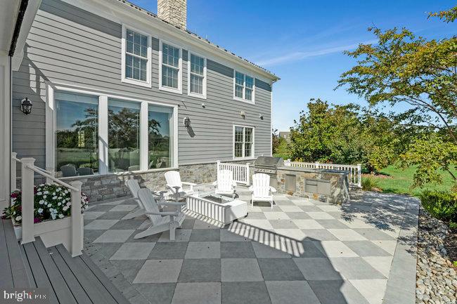 41865 Scotchbridge Place Ashburn, VA 20148 - Photo 77 of 93 a view of a patio with table and chairs and potted plants