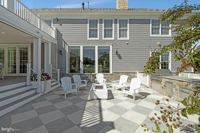 41865 Scotchbridge Place Ashburn, VA 20148 - Photo 78 of 93 a view of a patio with couches table and chairs and potted plants