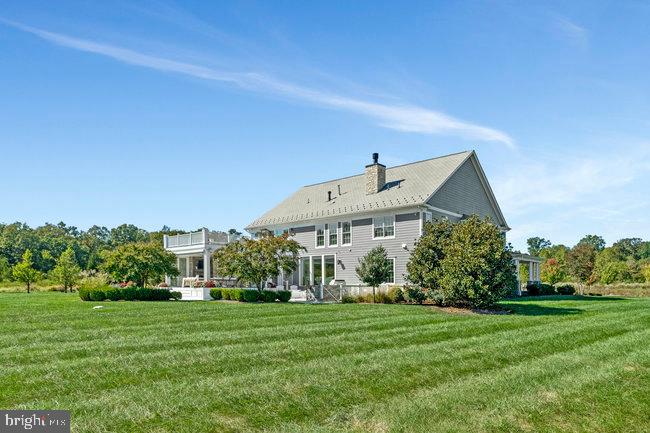 41865 Scotchbridge Place Ashburn, VA 20148 - Photo 87 of 93 a view of a big house with a big yard and large trees
