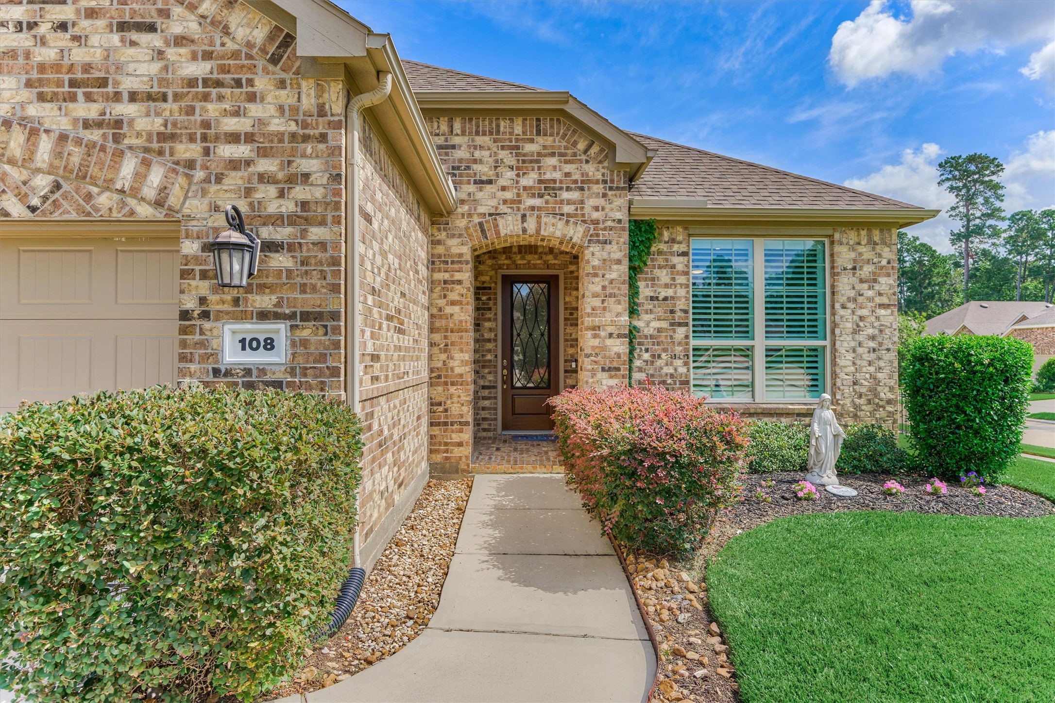 108 Wild Wick Way Spring, TX 77382 - Photo 8 of 44 The Spacious And Elegant Front Porch Protects Guests From The Elements.