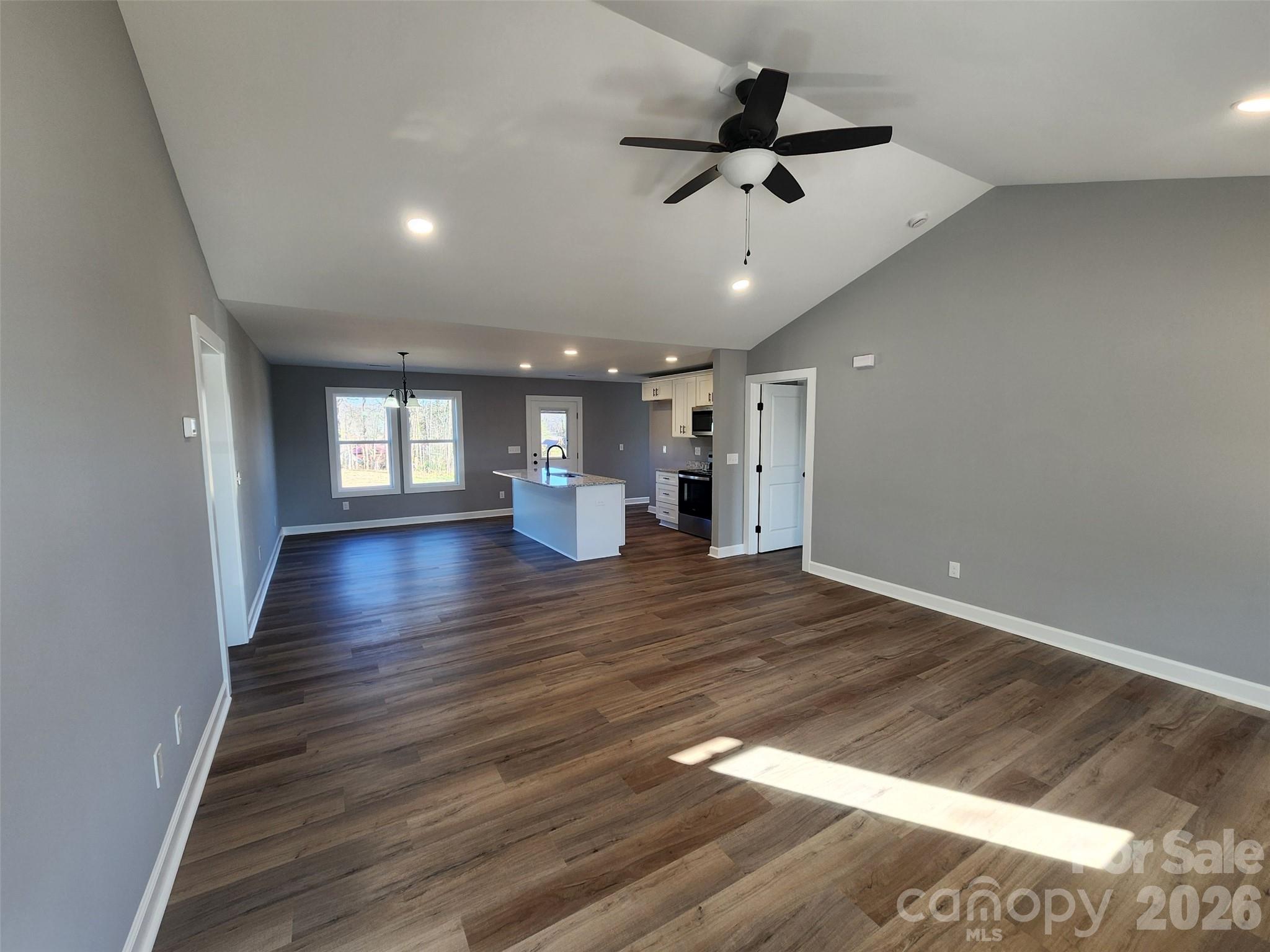 450 East Ridge Road Salisbury, NC 28144 - Photo 3 of 11 a view of an empty room and wooden floor and a window