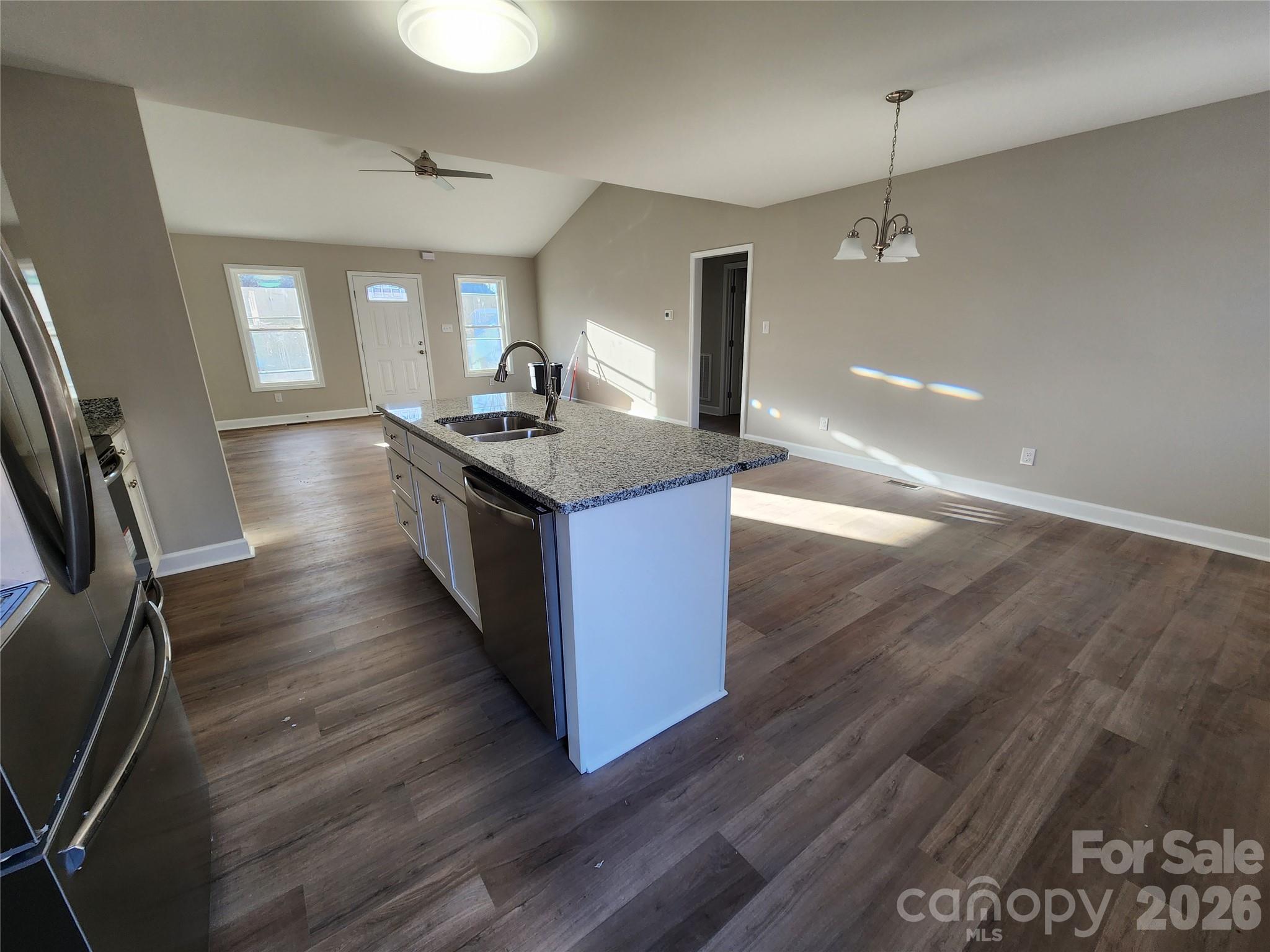 450 East Ridge Road Salisbury, NC 28144 - Photo 5 of 11 a kitchen with granite countertop a stove and wooden floor