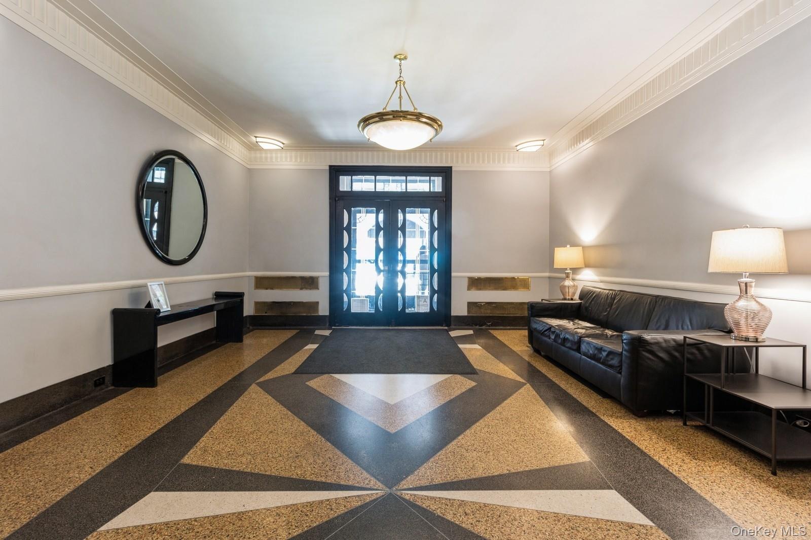 405 West 57th Street, Unit 4C Manhattan, NY 10019 - Photo 1 of 15 a living room with furniture a window and a table