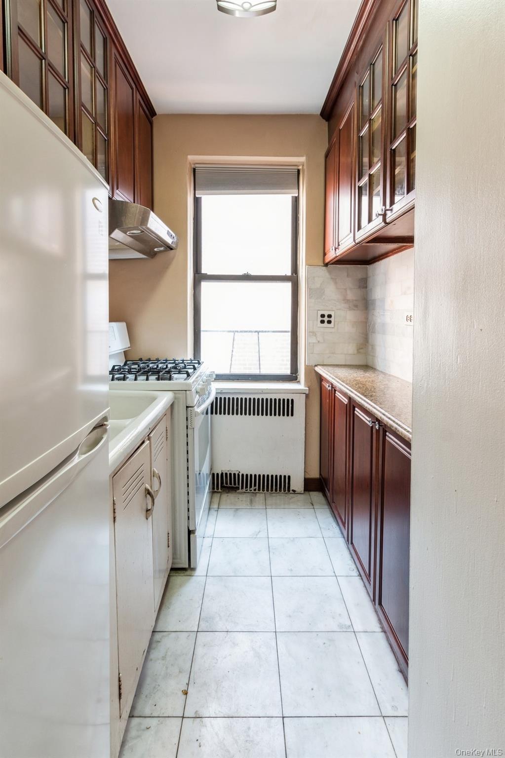 405 West 57th Street, Unit 4C Manhattan, NY 10019 - Photo 15 of 15 a kitchen with stainless steel appliances granite countertop a stove a sink and a microwave