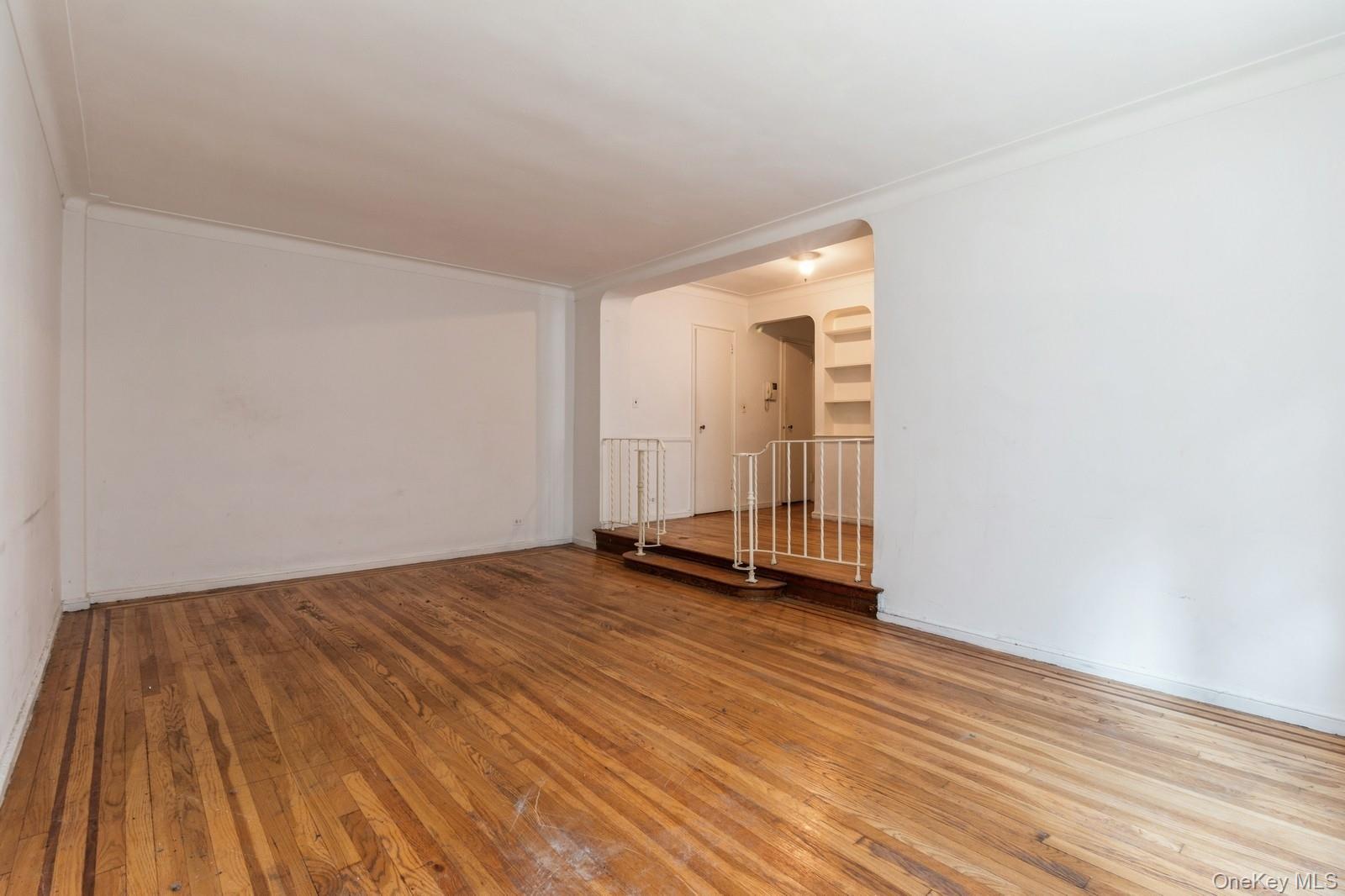 405 West 57th Street, Unit 4C Manhattan, NY 10019 - Photo 5 of 15 a view of a room with wooden floor and white doors
