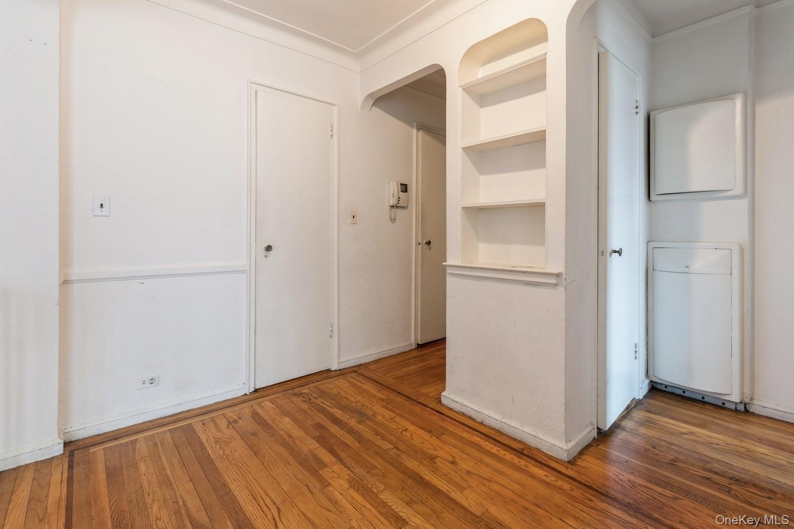 405 West 57th Street, Unit 4C Manhattan, NY 10019 - Photo 9 of 15 a view of an empty room with wooden floor and a window