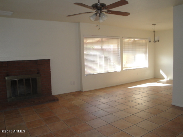 4234 East Apollo Road Phoenix, AZ 85042 - Photo 3 of 33 View of LR/DR (w/fireplace) from entry