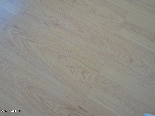 4234 East Apollo Road Phoenix, AZ 85042 - Photo 31 of 33 Laminate flooring in BRs