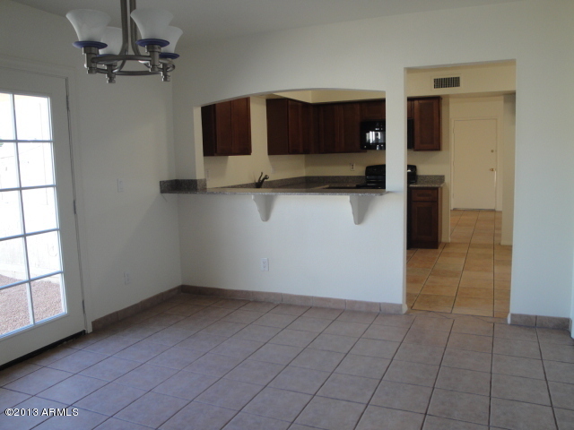 4234 East Apollo Road Phoenix, AZ 85042 - Photo 9 of 33 Kitchen and patio from FR
