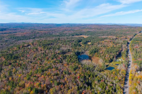 a view of a city with mountains in the background
