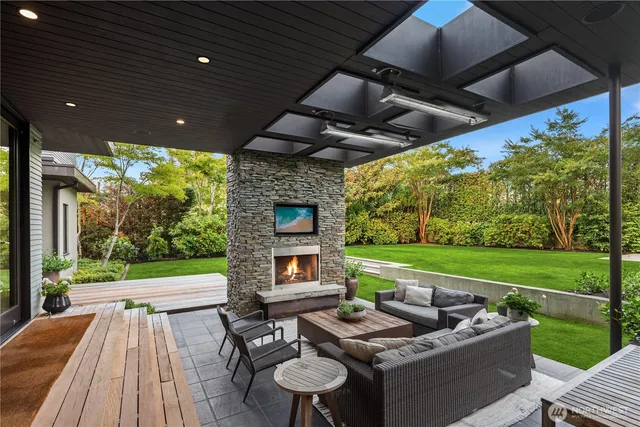 a patio view with a garden and outdoor seating