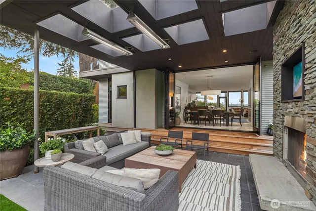 a balcony with furniture and a fireplace